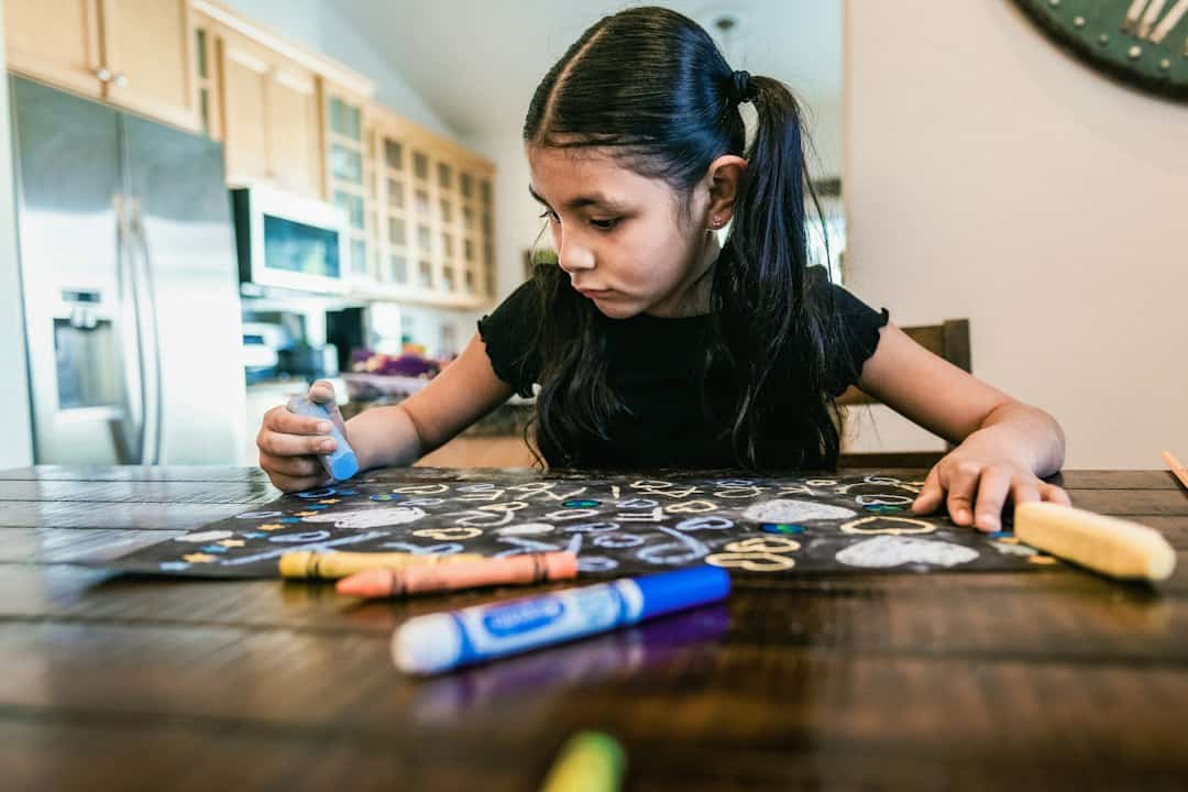 Child painting at a table during a homeschool art lesson