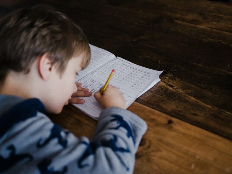 Child working on a math worksheet at home